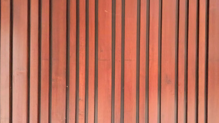 Vertical wooden slats with dark gaps background texture pattern