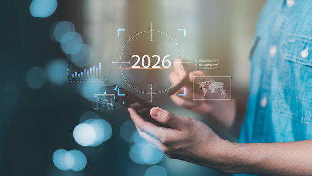 businessman using digital technology and data analytics to plan future goals for success in 2026. Concept of innovation, business growth, and strategic vision for modern corporate development