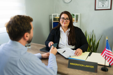 Immigration lawyer assisting client presenting passport documents