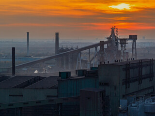 Aerial drone view of Industrial steel factory, iron works. Metallurgical plant. steelworks. Heavy industry in Europe, Poland, Dabrowa Gornicza. Air pollution from chimneys. Ecology and environmental