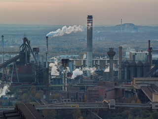 Aerial drone view of Industrial steel factory, iron works. Metallurgical plant. steelworks. Heavy industry in Europe, Poland, Dabrowa Gornicza. Air pollution from chimneys. Ecology and environmental