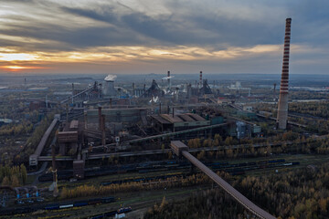 Aerial drone view of Industrial steel factory, iron works. Metallurgical plant. steelworks. Heavy industry in Europe, Poland, Dabrowa Gornicza. Air pollution from chimneys. Ecology and environmental