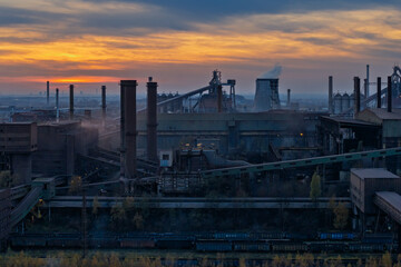 Aerial drone view of Industrial steel factory, iron works. Metallurgical plant. steelworks. Heavy industry in Europe, Poland, Dabrowa Gornicza. Air pollution from chimneys. Ecology and environmental