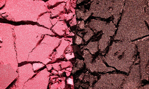 Pink and brown eyeshadow texture background. Cosmetic eye shadow product crumbled swatch
