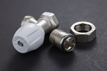 radiator tap for water supply on dark background