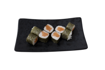 Salmon maki sushi rolls on black plate