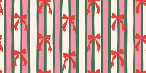Christmas seamless pattern with hand-drawn red bows on a vertical striped background. Festive holiday design in red, pink, and green for wrapping paper or textile print, vector illustration.