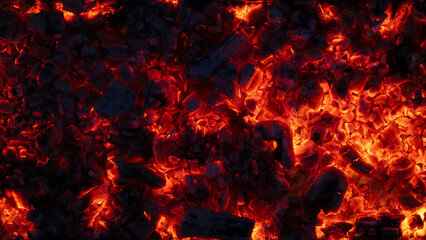 background of burning and glowing hot coals. smoldering embers of fire. flicker of burning coals at...