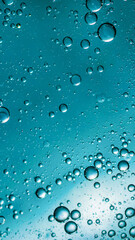 oil drops on water on blue background