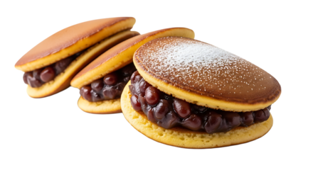Dorayaki pancakes filled with sweet red bean paste, dusted with powdered sugar, a delightful dessert.