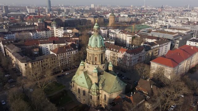 Aerial orbit around Baroque Christuskirche, iconic evangelical church in Mannheim, Germany, revealing surrounding cityscape