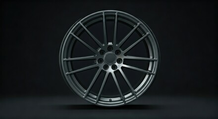 Sleek, dark gray alloy wheel with multiple spokes, centered on a dark background