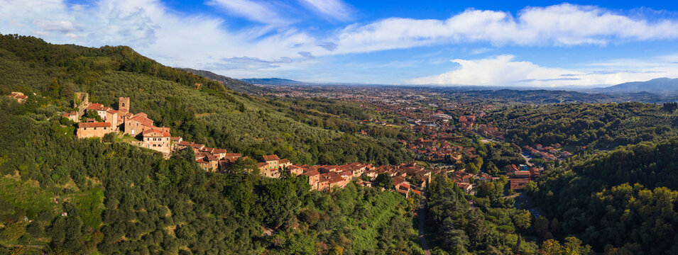 Aerial Panorama of Collodi: Iconic Vertical Medieval Village famous for hisBaroque Gardens of Villa Garzoni and Pinoccio park. Tuscany, Italy