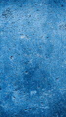 wall painted with blue paint with an interesting texture