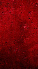 wall painted with red paint with an interesting texture