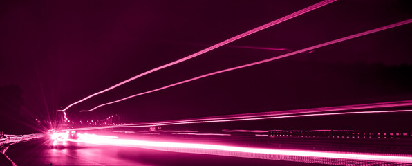 violet car lights at night. long exposure