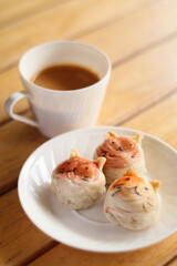 Cute Chinese Pastry or moon cake stuffed with salted egg yolk on wood plate