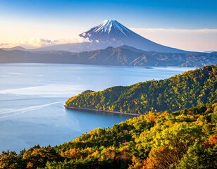 Scenic vista featuring a snow-capped mountain, lake, and colorful forest
