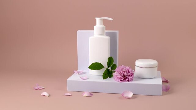 cosmetics containers on a white rectangular podium and a rose flower on a pink background