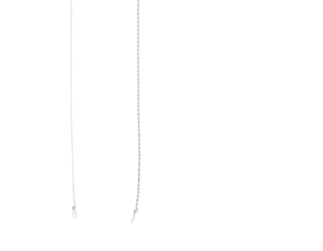 Two thin, vertical, abstract lines of differing textures against black