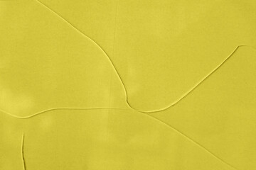 Minimal yellow glass texture with soft intersecting lines forming smooth geometric shapes across surface. Natural background for modern design, creative layout and visual branding