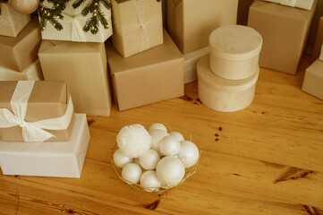 close-up of wrapped Christmas gifts lying on the floor under the Christmas tree