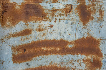 abstract background of an old painted grey rusty metal surface close up