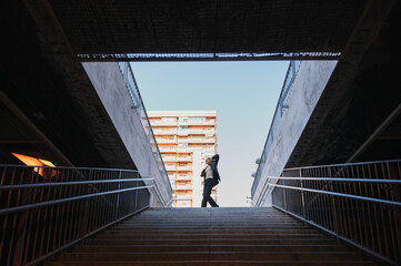 Man dancing on urban stairway, city lifestyle © Gonzalo Infiesta