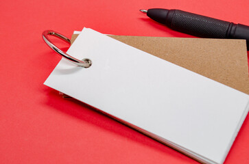 White banner shape notepad with customizable space for text on red background.