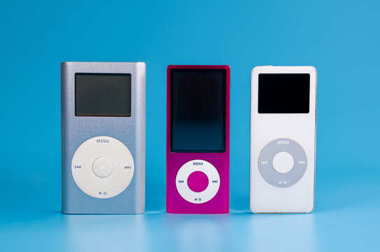 Fukuoka, Japan - november 4, 2025 : various generation of apple ipod music player devices isolated on blue background
