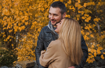 Romantic European couple in the park love, warmth and emotional connection