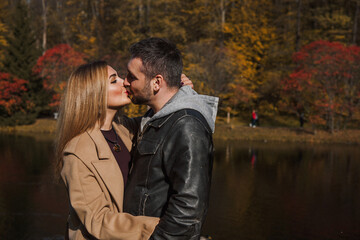 Romantic European couple in the park love, warmth and emotional connection
