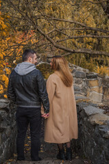 Romantic European couple in the park love, warmth and emotional connection