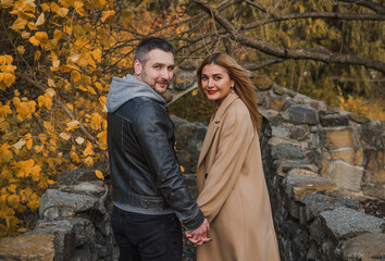 Romantic European couple in the park love, warmth and emotional connection