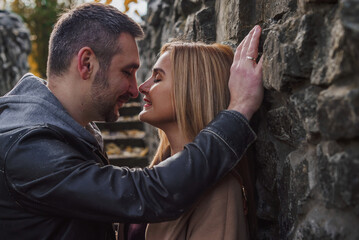 Romantic European couple in the park love, warmth and emotional connection