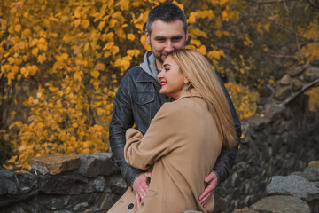 Romantic European couple in the park love, warmth and emotional connection
