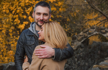 Fototapeta premium Romantic European couple in the park love, warmth and emotional connection