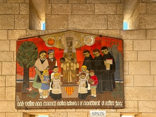 Nazareth, Israel, 5 May 2025. Basilica of the Annunciation. Spanish ceramic tile mural showing the Virgin Mary and Jesus, accompanied by Catalan saints and monks.