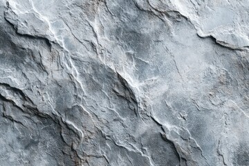 Stone wall close up shows layered grey and white rock formations providing natural texture and depth