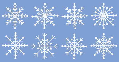 Set of cute white snowflakes isolated on blue background.