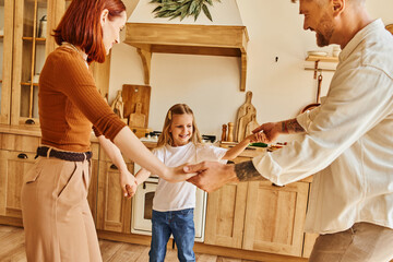 Joyful moments shared by family in their cozy home during playtime and laughter