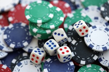 Dice game on the poker table in the casino. A successful combination of dice brought a lot of winning chips
