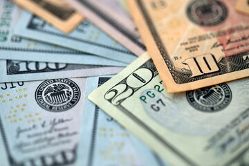 Big amount of different dollar bills close up. Hundred fifty twenty ten and five dollar banknotes