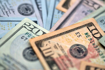 Big amount of different dollar bills close up. Hundred fifty twenty ten and five dollar banknotes