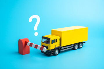 The truck is stopped by a closed barrier. Refusal of transit of cargo. Logistics problems. Supply chain crises, and bureaucratic obstacles. Customs delays, trade restrictions, and export problems.