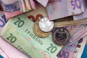 Big amount of different Ukrainian hryvnia money bills. Pile of crumpled ukrainian banknotes