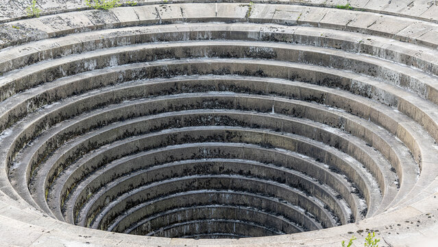 Circular water overflow drain at Ladybower Reservoir Derbyshire Peak District UK
