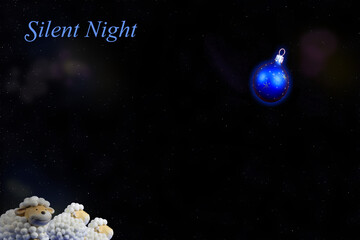 Silent Night Blue Christmas ball Glow and nosy sheep
Peaceful stars shine above glowing blue Christmas ornament.
