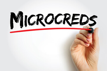 Microcreds word in bold brush font underlined with red line by a hand, symbolizing micro-credentials, digital certification, skill verification, modern learning, professional education innovation