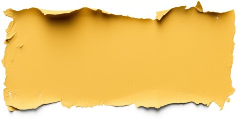 Fototapeta premium A torn, textured piece of yellow paper with ragged edges, showcasing a vibrant hue and an artistic feel.